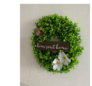 Artificial eucalyptus wreath with home sweet home wooden plaque and white daisies