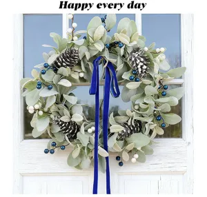 Detailed view of a handmade artificial lamb's ear wreath with pine cones and berries