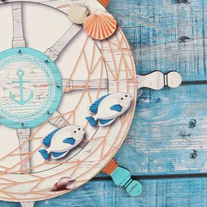 Wooden nautical steering wheel wall hanging, ocean themed home decor piece, blue wood.