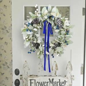 Artificial lamb's ear wreath with pine cones and long blue velvet ribbon for home decor