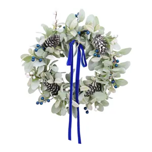 Artificial frosted lamb's ear wreath decorated with pine cones and a blue velvet ribbon