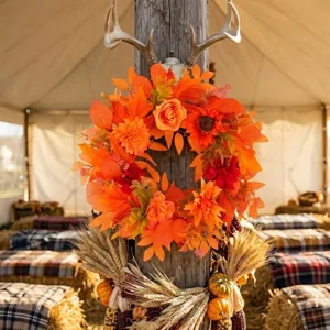 Thanksgiving harvest wreath with orange maple leaves and sunflowers for door decor
