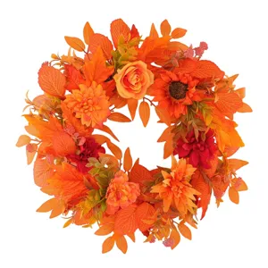 Autumn Thanksgiving wreath with orange maple leaves and sunflowers for door decor