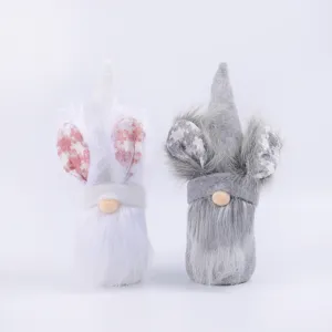 Pair of adorable plush Easter gnomes featuring rabbit ears for tabletop spring decorations