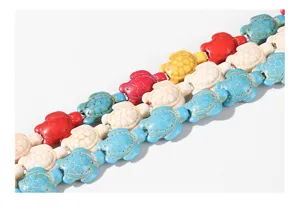 Macro detail of vibrant colorful turtle-shaped turquoise loose beads for DIY jewelry crafting