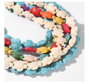 Close-up of colorful turtle-shaped synthetic turquoise beads for jewelry making