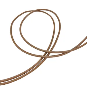 Detail showing the fine texture and flexible coil of the brown leather cord belt.