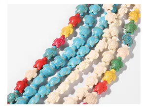 Close-up of vibrant colorful turtle-shaped turquoise beads for DIY jewelry making crafts