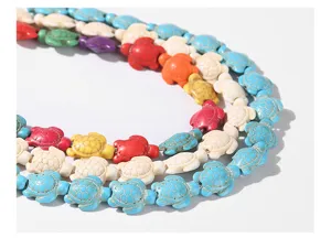 Close-up detail of colorful turtle-shaped turquoise stone beads for jewelry making