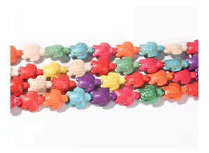 Detailed macro view of colorful turtle-shaped synthetic turquoise beads for DIY jewelry