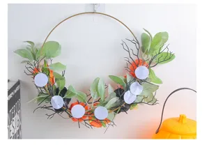 Detailed back view of handcrafted Halloween iron ring wreath with pumpkins and roses