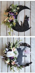 Detail view of two unique Halloween moon cat wreaths with floral and star accents