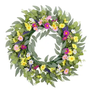 Couronne de fleurs printanières avec eucalyptus et marguerites colorées pour la maison
