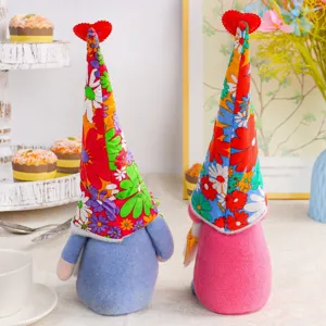 Pair of colorful floral gnome dolls for harvest and thanksgiving party decorations.
