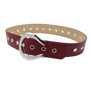 Fashionable red PU leather belt featuring a silver horseshoe buckle and decorative metal grommets