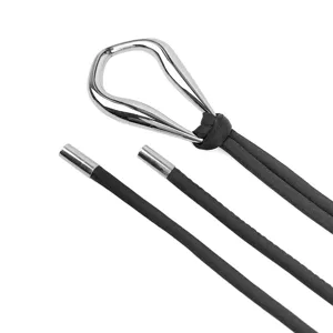 Close-up detail of black thin cord belt with silver teardrop buckle for dresses