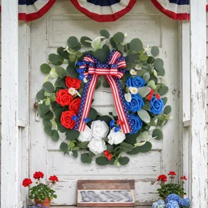 Independence Day wreath with red white and blue flowers and patriotic flag bow decoration
