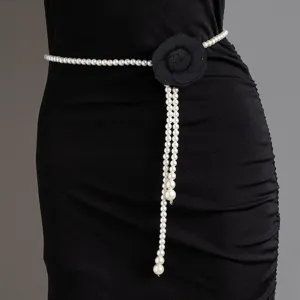Elegant pearl waist chain featuring a black camellia flower and pearl tassels detail