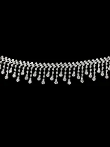 Detailed close-up of a silver rhinestone fringe chain with sparkling droplet tassels.