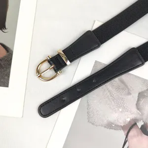 Elegant women's black elastic belt featuring a vintage golden D-shape metal buckle.