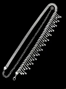 Detailed view of a silver tassel waist chain with shimmering rhinestones for belly dance.