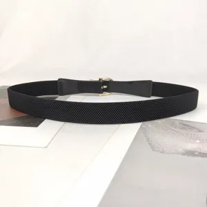 Elegant vintage black elastic belt for women featuring a classic golden metal horseshoe buckle