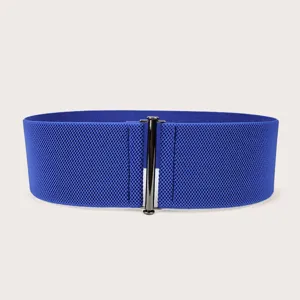 Professional studio shot of a wide blue elastic waist belt for women featuring a sleek metallic clasp