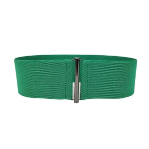 Vibrant emerald green elastic wide waist belt for women featuring a sleek metallic buckle