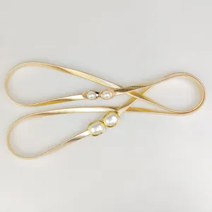 Elegant golden metal spring belts for women featuring faux pearl decorative buckles