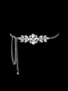 Elegant silver chain belt with shimmering rhinestone floral detail on black background