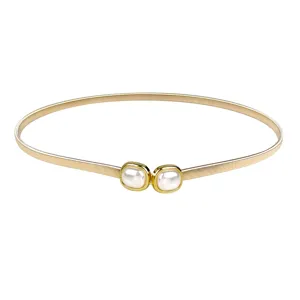 Slim gold elastic metal spring belt featuring decorative square pearl buckles for women