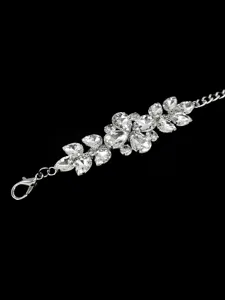 Close-up detail of elegant silver waist chain belt featuring sparkling rhinestone leaf motifs