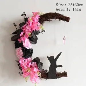 Moon-shaped Halloween wreath with pink flowers and black cat silhouette decor