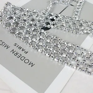 Detailed macro view of the silver faceted beaded harness chain with hollow grid structure