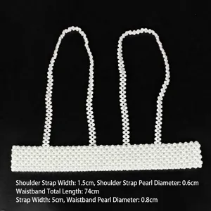 Detail view of elegant white pearl beaded harness belt with straps and waist band