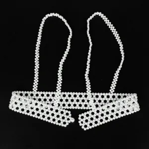 Close-up view of elegant white pearl beaded body chain vest and waist belt accessory