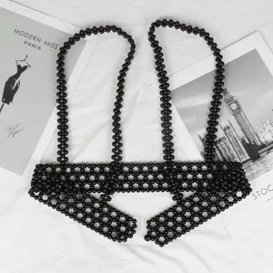 Close-up detail of a fashion black beaded harness vest belt layering accessory