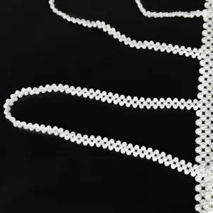 Elegant white pearl body chain and decorative strap for fashion dresses and blazers.