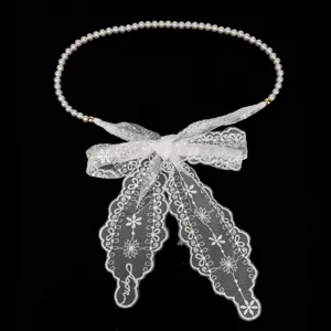 Elegant white lace bow belt with pearl chain decoration for women's dresses.
