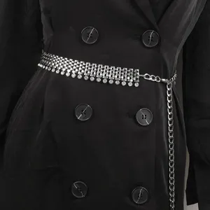 Close-up detail of a silver metal waist chain belt featuring sparkling rhinestone dangles
