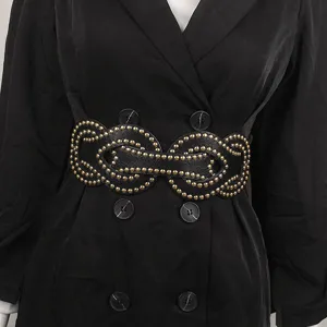 Close-up of black punk style elastic wide belt with golden rivet patterns on a coat
