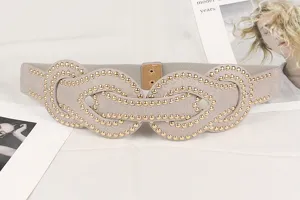 Detailed close-up showing gold rivet studs pattern on a wide punk elastic waist belt.