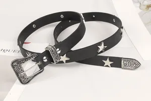 Detail of black star belt featuring silver pentagram studs and vintage ornate Western buckle.