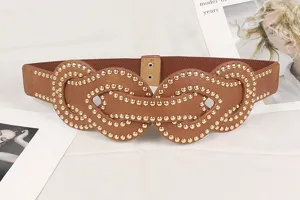 Close-up of punk style wide brown elastic belt with gold rivet studded buckles