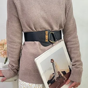 Fashionable black wide elastic waist belt for women with elegant gold buckle accent