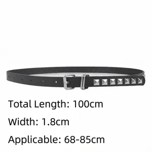 Close-up detail of black thin waist belt featuring square silver studs and sizing parameters