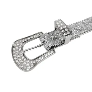 Close-up of a silver Y2K fashion belt with sparkling rhinestones and glitter detail