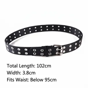 Detailed view of punk style black double grommet belt with silver buckle hardware