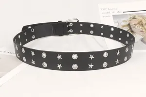 Close-up detail of a black punk style belt featuring silver star studs and metal eyelets
