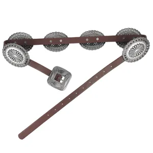 Detailed view of a brown Western belt featuring ornate silver-toned floral metal conchos